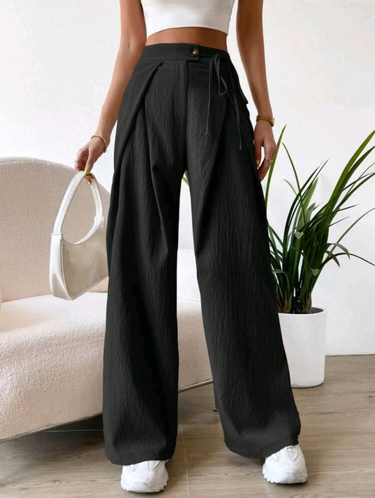 Pantalon à taille haute avec détails plissés et jambe large