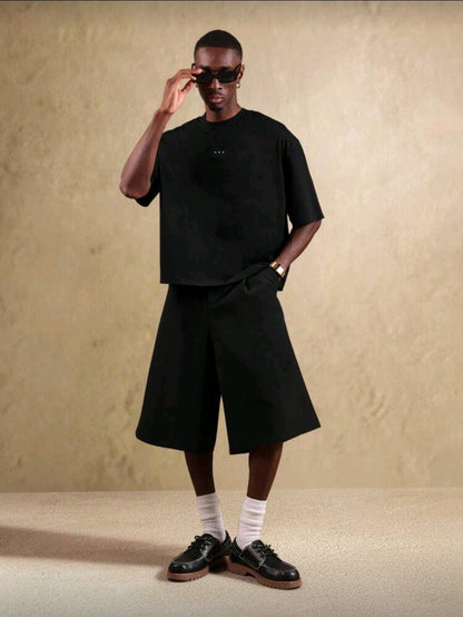 SUMWON T-shirt streetwear oversize, design urbain avec impression de texte calligraphié au dos. Style mode casual contemporain unisexe