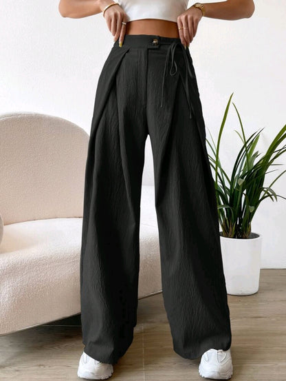 Pantalon à taille haute avec détails plissés et jambe large